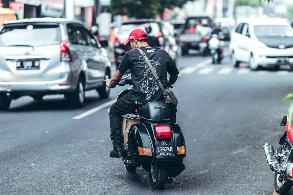 Photo Of Man Riding Motorcycle On The Road