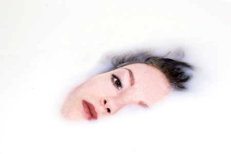 Womans Face On White Liquid