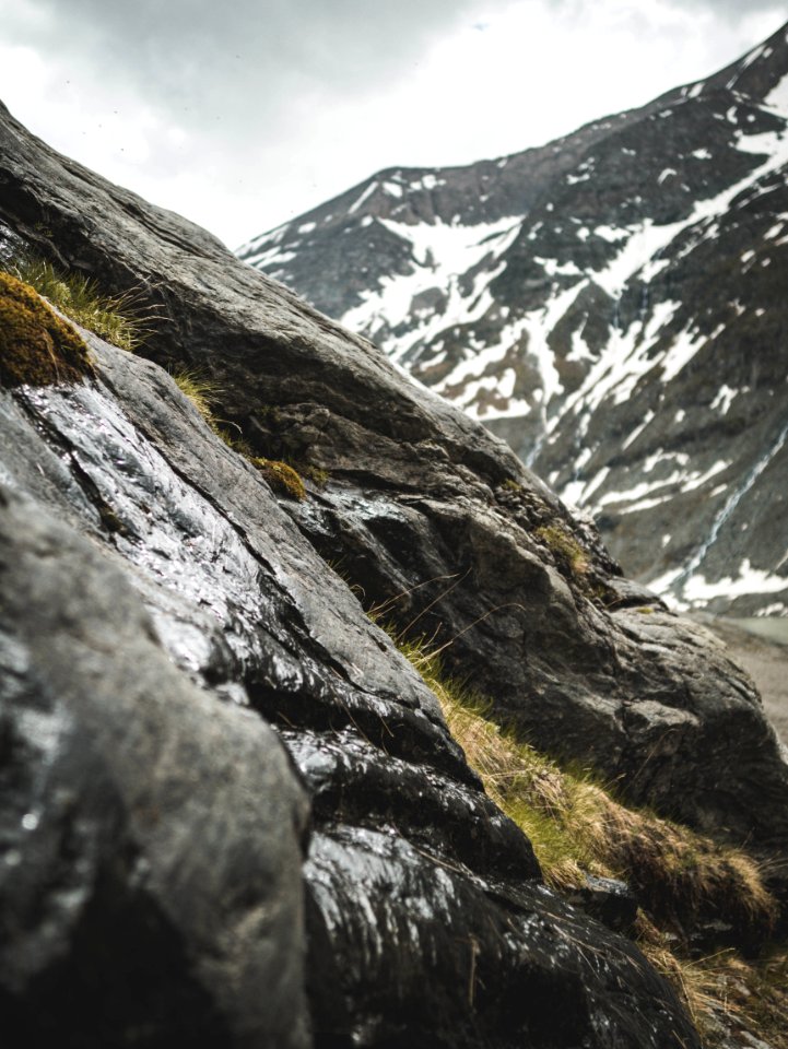 Rocky Mountain With Green Grasses At Daytime