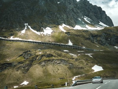 Silver Car On Road Near Mountain At Daytime photo
