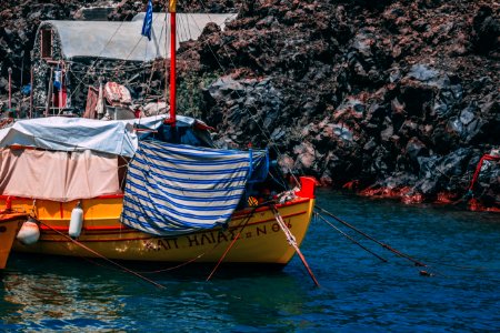 Yellow And Red Boat On Body Of Water