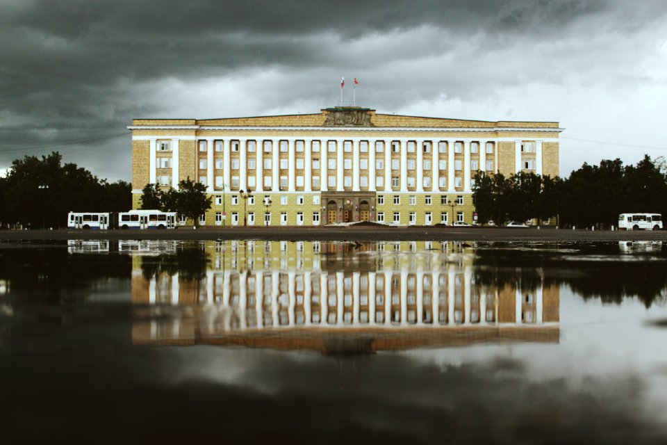 White And Beige Concrete Building Near Water