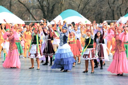 Women And Girls Wearing Traditional Dresses Holding Up Two Hands photo