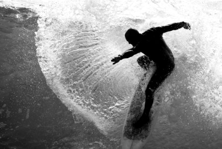 Grayscale Photo Of Man On Surfboard