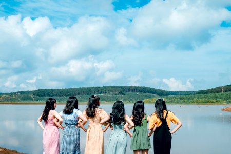 Six Girls In Front Of Body Of Water photo