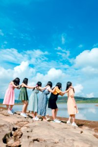 Six Women Standing By The Lake