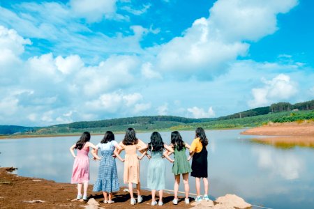 Six Girls Standing In Front Of Lake photo