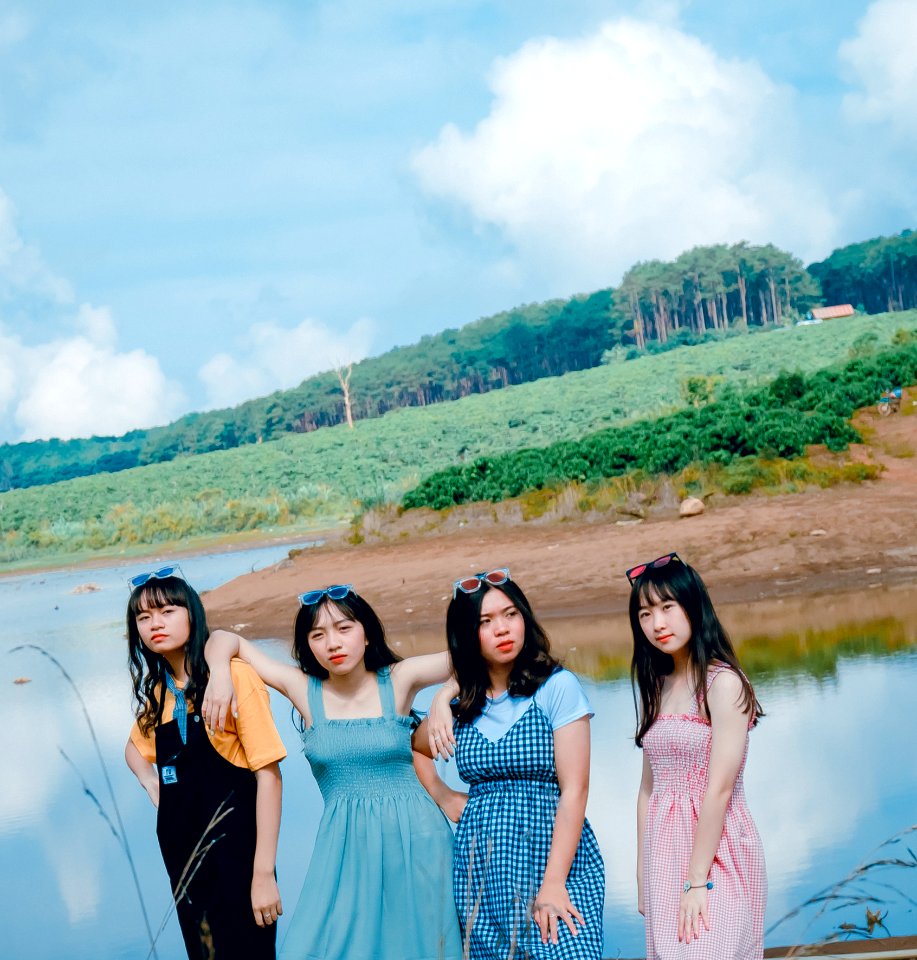 Four Women Near Body Of Water