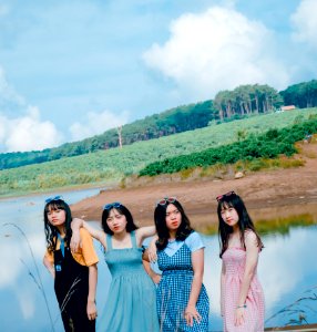 Four Women Near Body Of Water photo