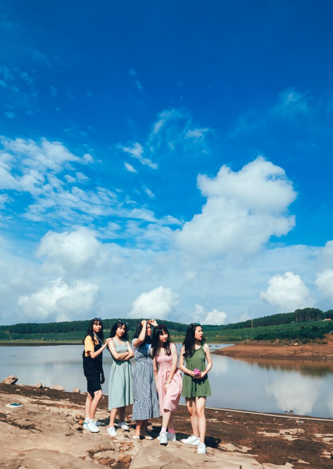 Women Standing Near Body Of Water photo