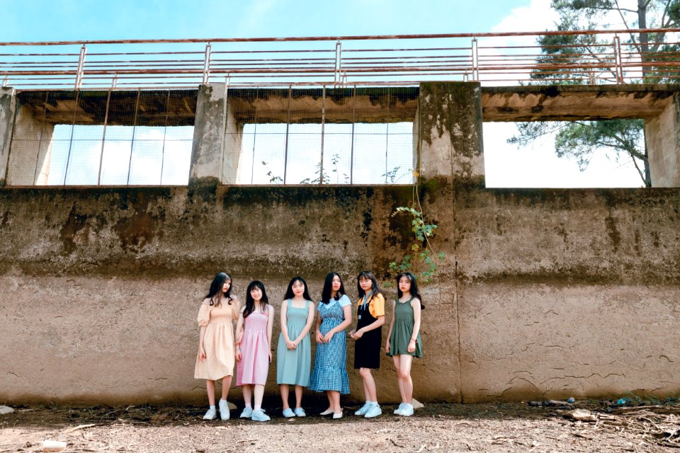 Six Women Standing Near Wall