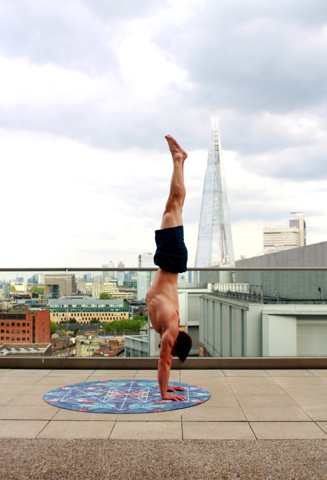 Man In Blue Shorts Tumble Upside Down
