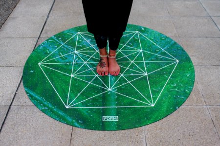 Person Standing On Green Round Mat photo