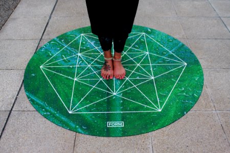 Person Standing On Green Round Mat