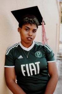 Woman Wearing Green And White Adidas Jersey Shirt photo