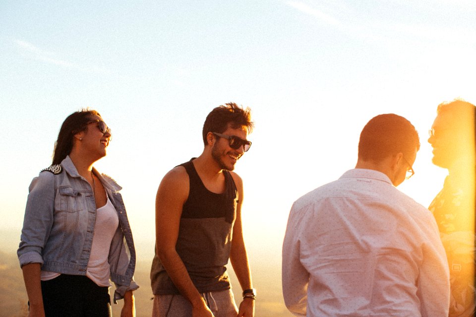 Man Wearing Black Tank Top Standing Beside Woman Wearing Blue Denim Jacket photo