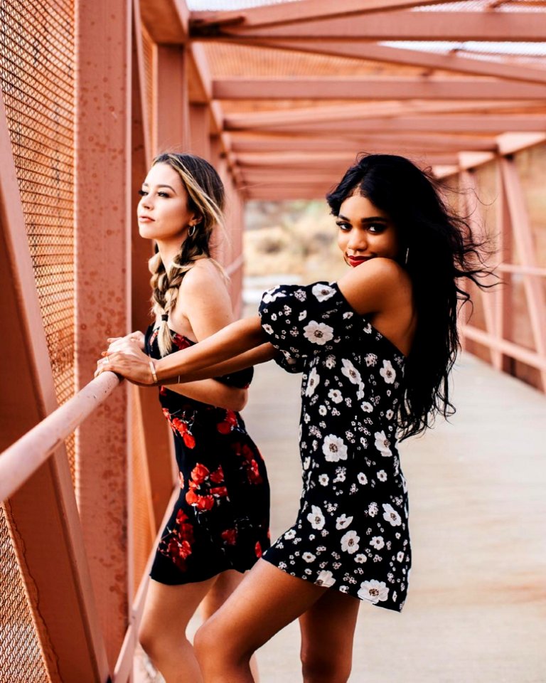 Photography Of Two Women On Bridge