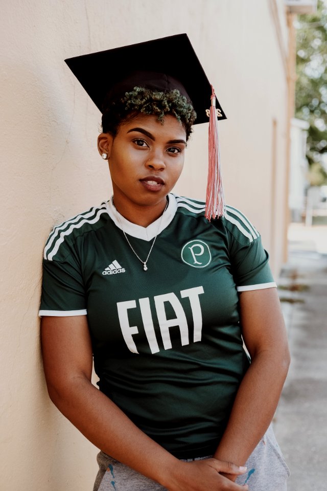 Woman Wearing Green And White Adidas Jersey T-Shirt