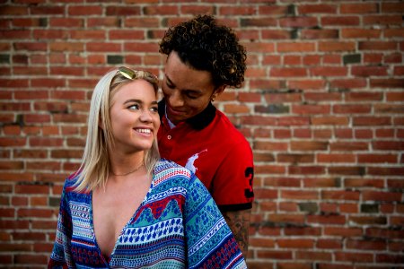 Photography Of Woman In Front Of Man In Red Polo Shirt