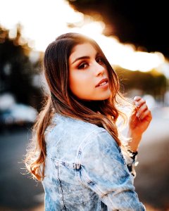 Shallow Focus Photography Of Woman Wearing Blue Denim Jacket