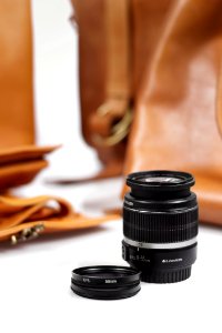 Black Camera Lens On White Surface