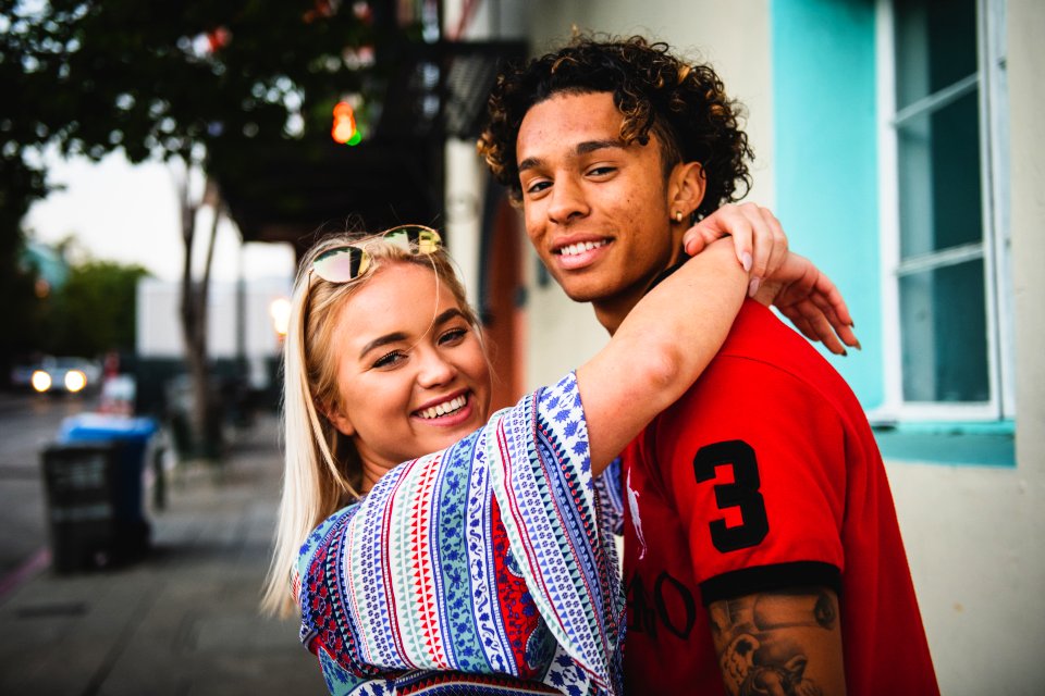 Close-Up Photo Of Woman Hugging A Guy