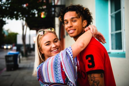 Close-Up Photo Of Woman Hugging A Guy photo