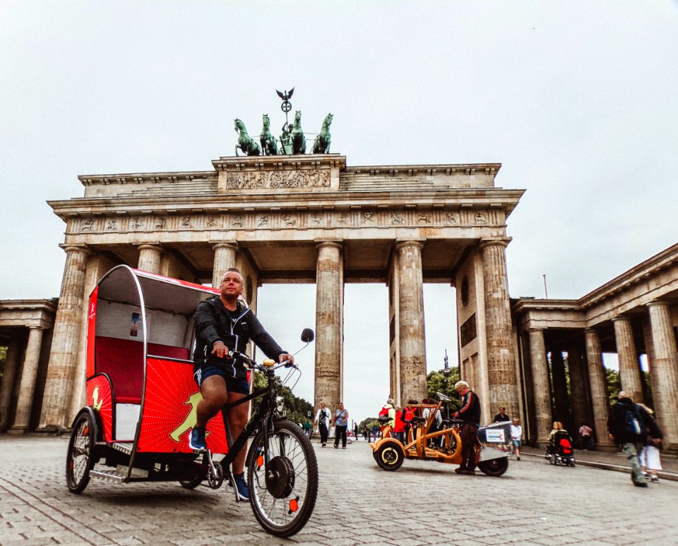 Man In Black Hoodie Riding Trike