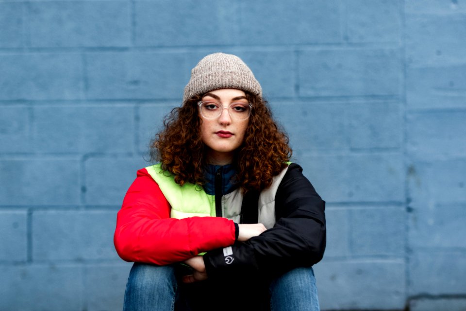 Woman Wearing Red And Black Zip-up Jacket photo