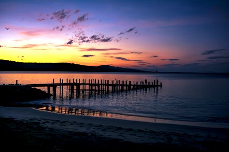 Silhouette Of Seadock On Body Of Water During Sunset photo