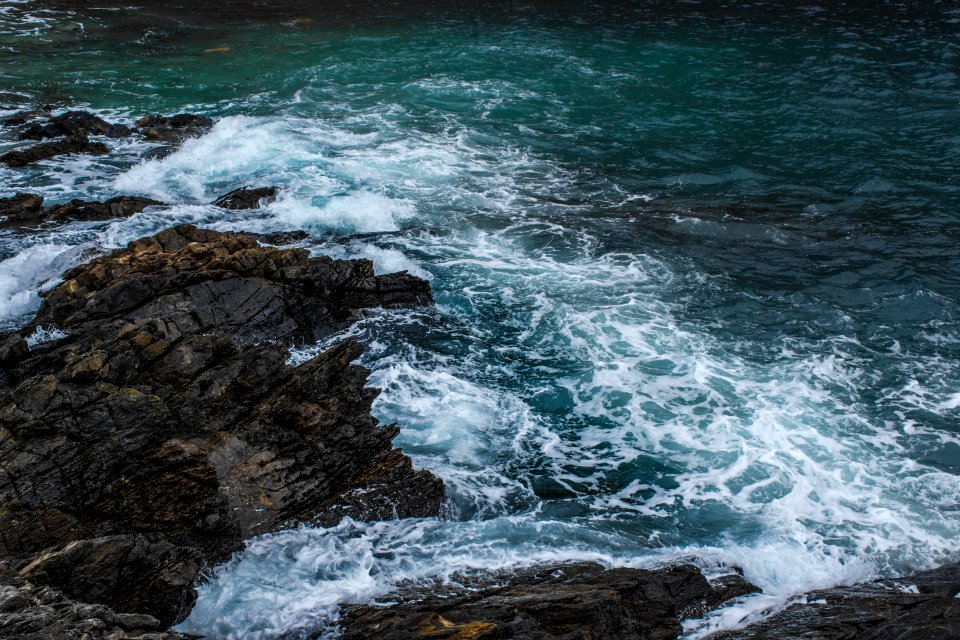 Brown Rock In Body Of Water