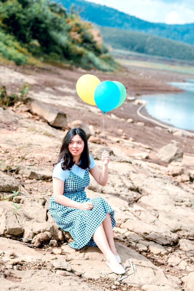 Woman Holding Balloons photo