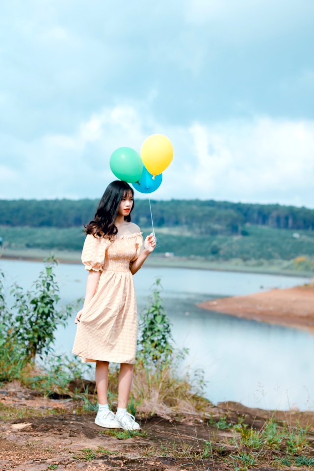 Woman Holding Balloons photo