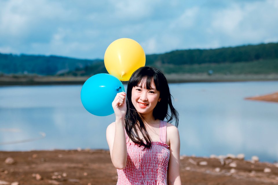 Woman Holding Balloons photo