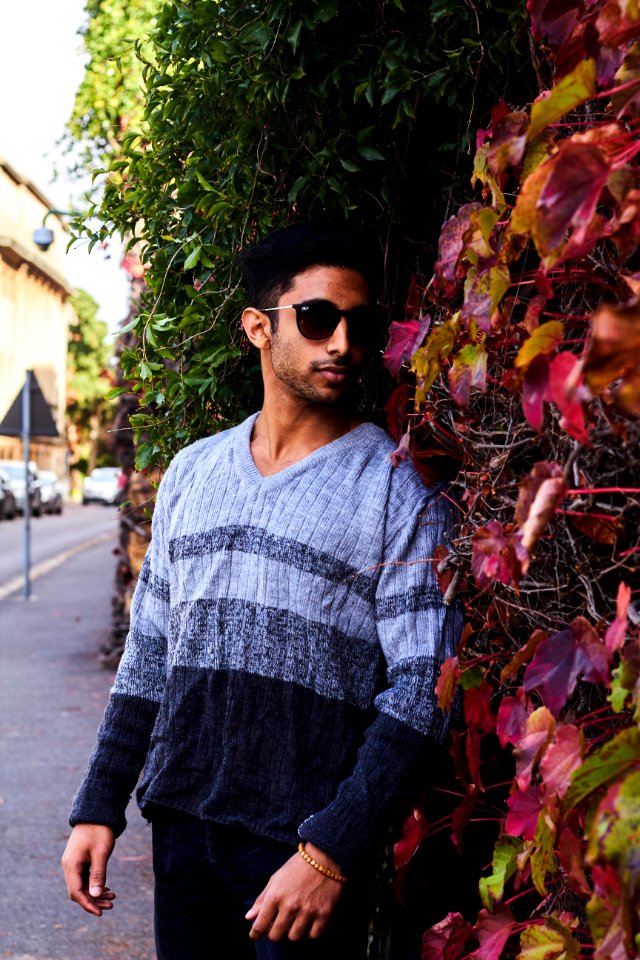 Photography Of A Guy Near Leaves