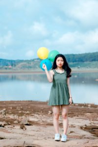 Woman Holding Three Balloons photo