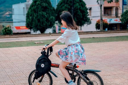 Woman Riding On Bike photo