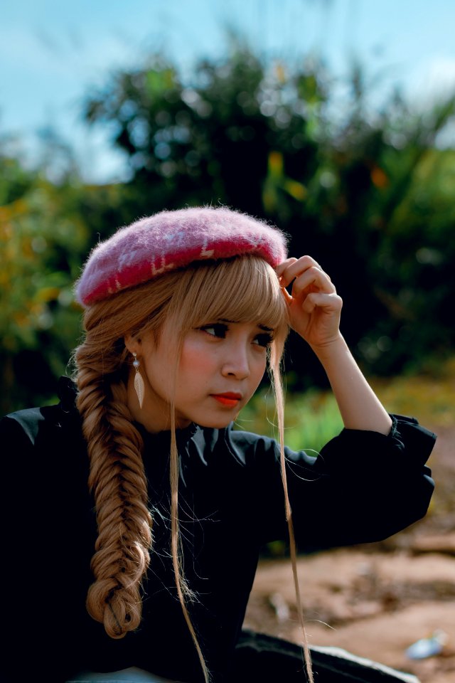 Close-Up Photography Of A Woman With Braided Hair photo