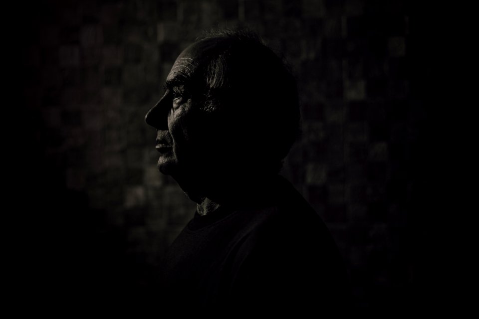 Side View Of A Man In Black Top