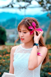 Brown Haired Woman In White Sleeveless Top In Bokeh Photography photo