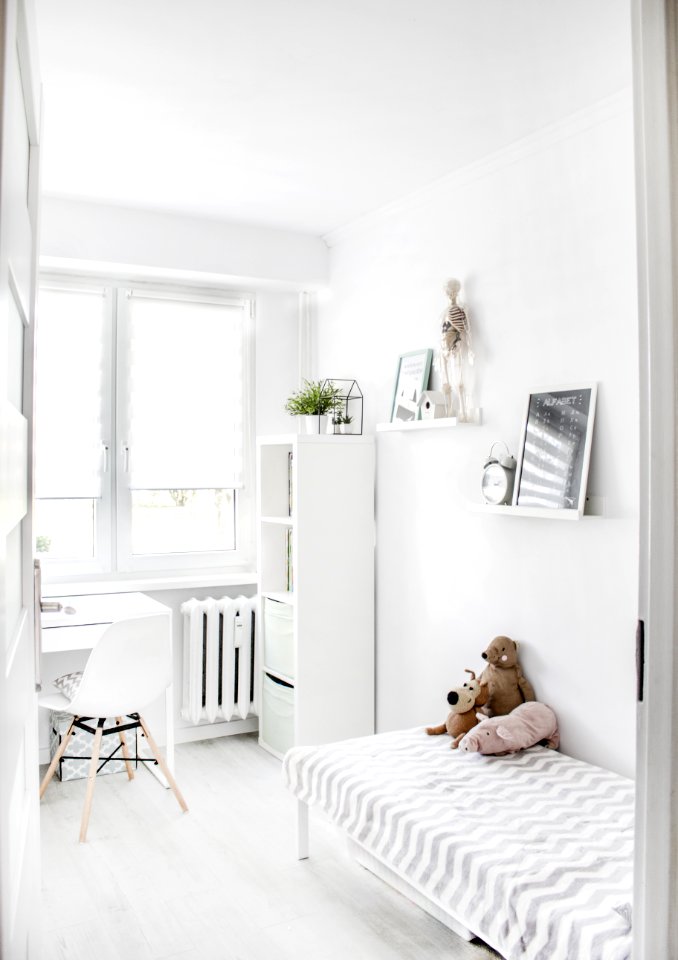 Plush Toys On Top Of White And Grey Mattress Inside Bedroom