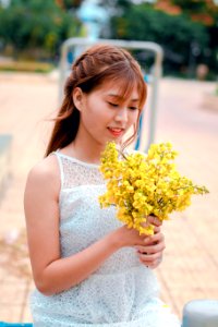 Woman Holding Yellow Petaled Flower Bouquet photo