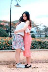 Two Woman Hugging Eachother photo