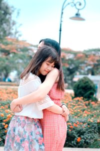 Two Women Hugging Each Other photo