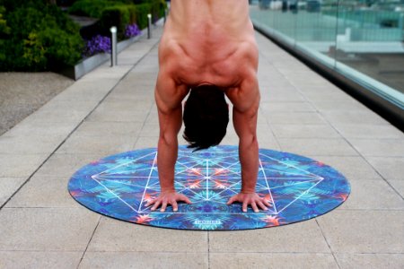 Man On Round Blue Floral Mat photo