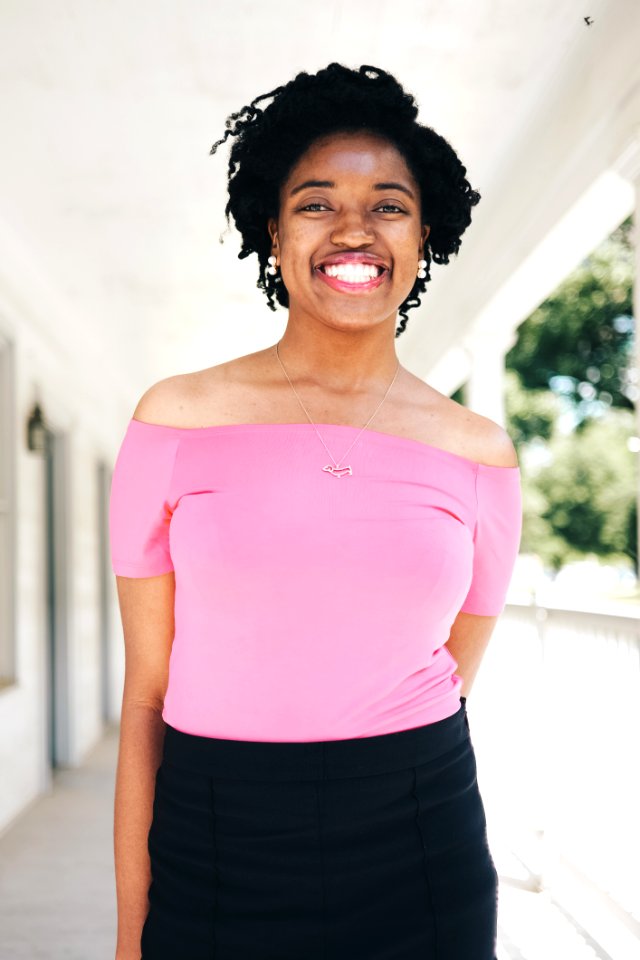 Woman Wearing Pink Tube Top And Black Bottoms