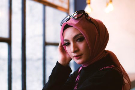 Woman In Pink Headdress With Sunglasses On Her Head