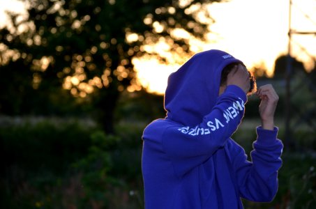 Shallow Focus Photo Of Man In Blue Hoodie photo