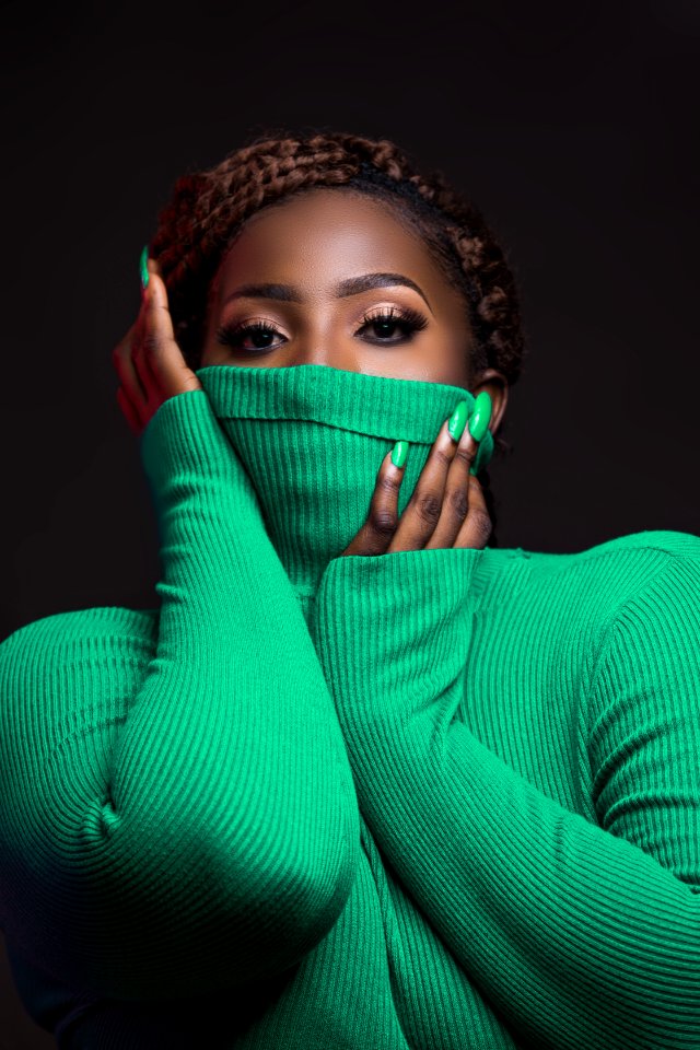 Woman Wearing Green Rib Turtleneck Sweater
