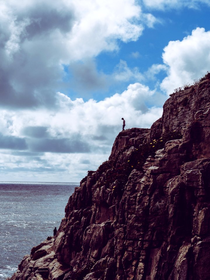 Person Standing On Cliff
